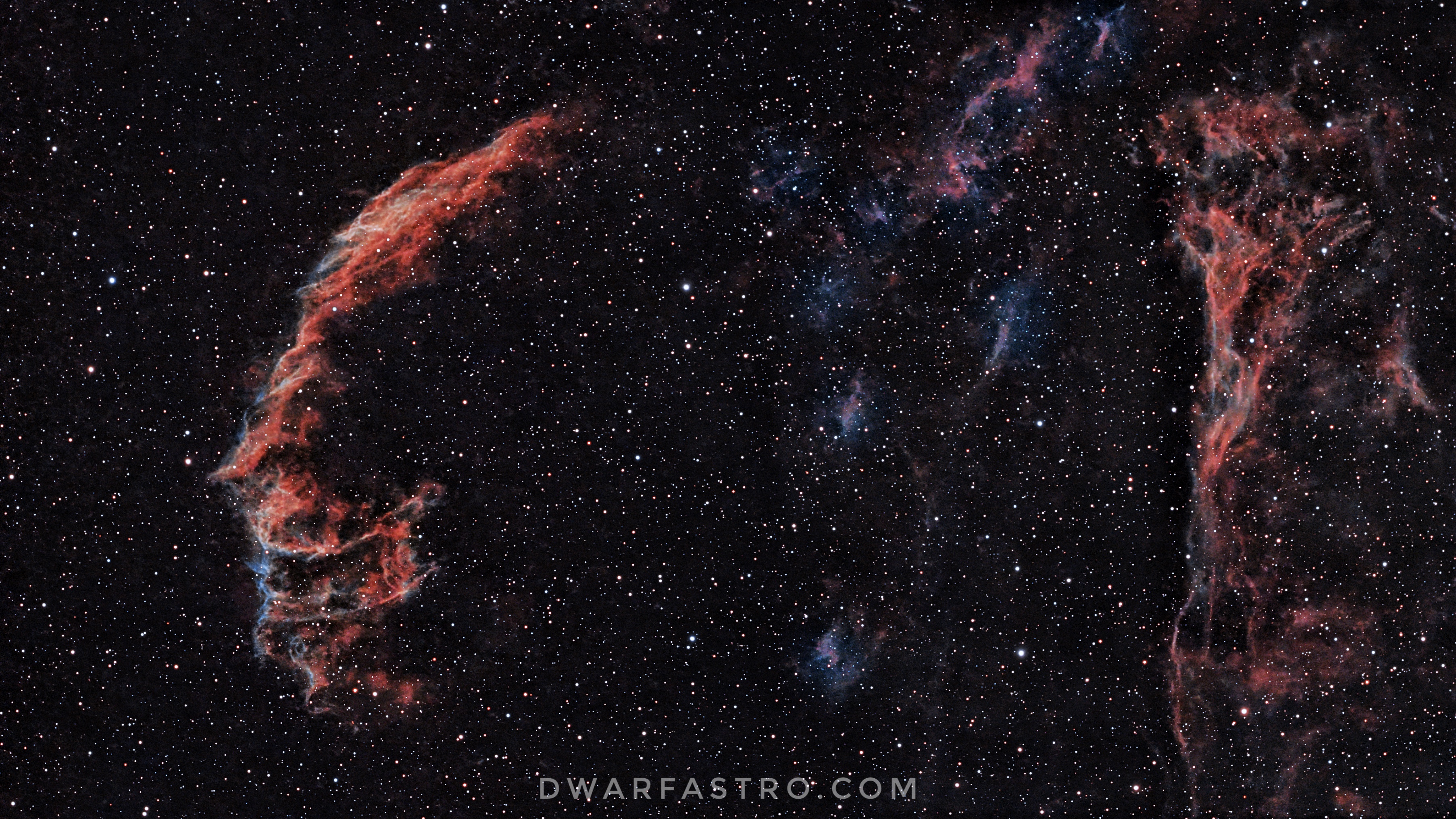 Eastern Veil Nebula (NGC 6992) in Cygnus, part of the Cygnus Loop supernova remnant, captured with the DWARF 3 smart telescope using a Duo-Band filter, showing the bright braided red and cyan filament structure.